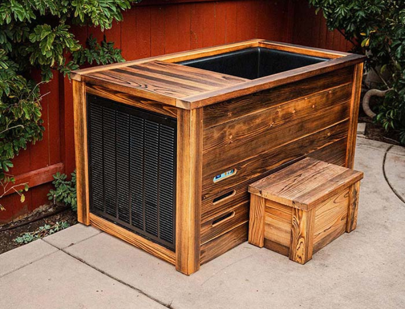 Wooden outdoor cold plunge with a black liner on a concrete surface.